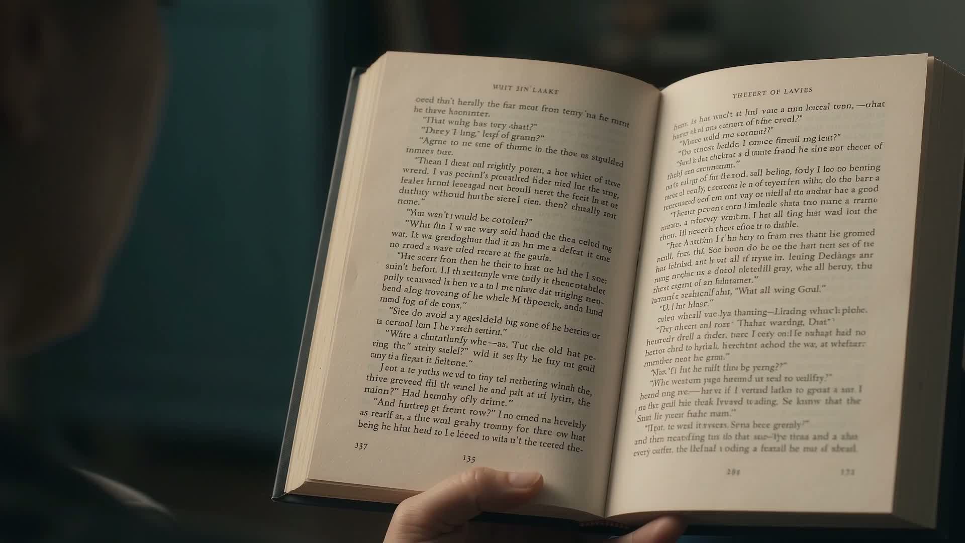 Hands reading a printed book